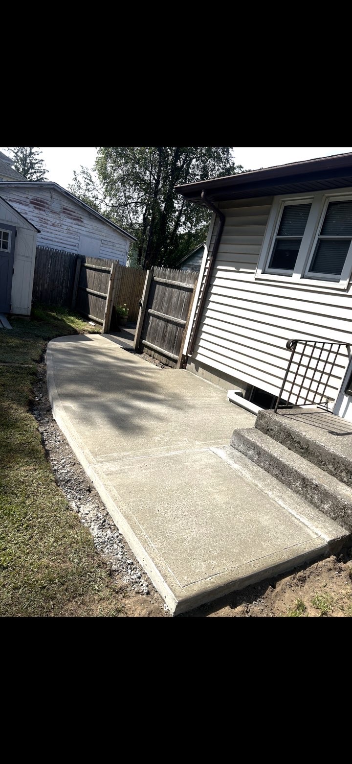 After: new curved concrete side walkway