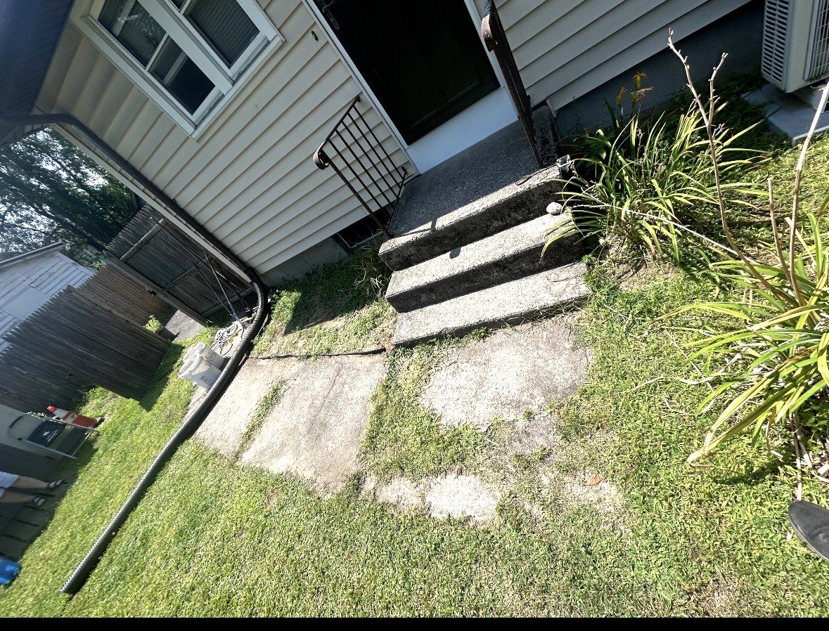 Before: old side walkway with uneven slabs and grass